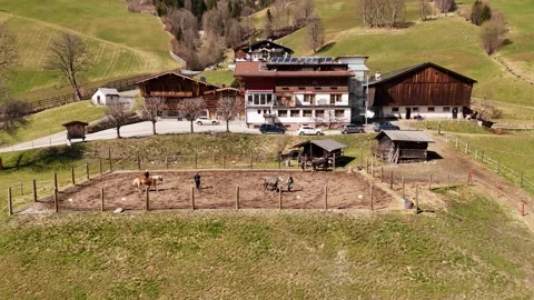 4K 60fps Drone Static Shot: Alpine Farmhouse and Horse Training, Saalbach Stock Footage 332668454