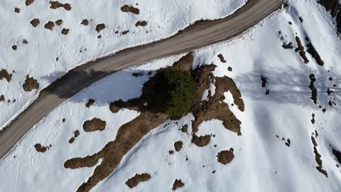 4K 60fps Drone Top-Down Descending Spiral Left over Alpine Road Видео 331665936