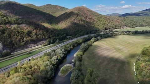 4K 60fps Forward Drone Flyover: Hron River And Highway Near Tekovska Breznica Stock Footage 345983121