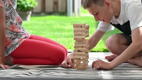 4K 60fps video of two happy children playing with wooden blocks. Having fun t Video stock 161115765
