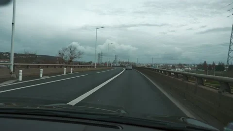4K 60p Windshield Hood View. Driving Car Along Highway Bridge. Industrial Ar Video stock 130851808