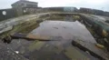 4K abandoned swimming pool with graffiti all around it on a rainy day 4k or 4k+ Resolution