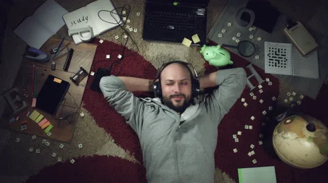 4k Above Science Background of a Man Listening to Music Stock Footage