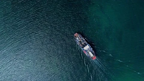 4k Above view of ship with cargo moves on lake outdoors irrl. Stock Footage 219631141