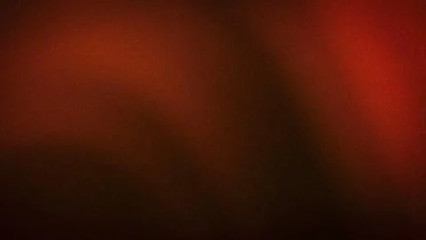 This 4K abstract background features a grainy gradient effect in dark brown o Stock Photos