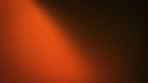 This 4K abstract background features a smooth gradient blending orange, black Stock Illustration