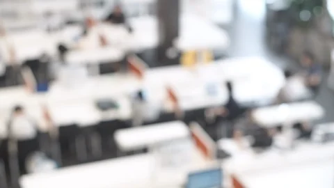 4K. Abstract blurred public library interior with people on modern desk Stock-Footage 91079510