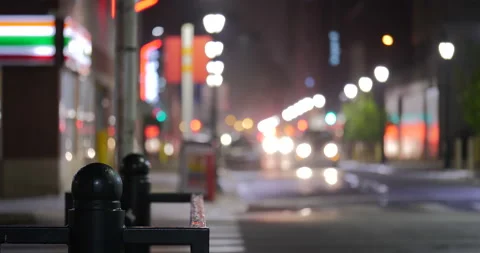 4K ABSTRACT SHOT OF SIDEWALK RAILING WITH AMBULANCE IN BACKGROUND Stock Footage 131126204