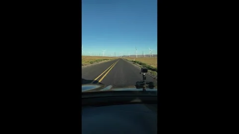 4K action camera driver's point of view rotating wind turbines in Oregon, USA Видео 341740073