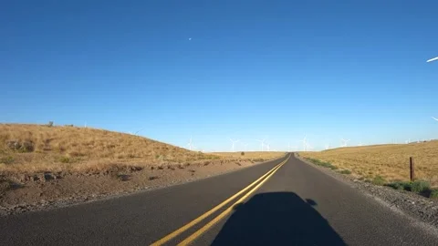 4K action camera driver's point of view rotating wind turbines in Oregon, USA Видео 341786242