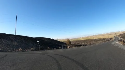 4K action camera driver's point of view rotating wind turbines in Oregon, USA 스톡 동영상 341786620
