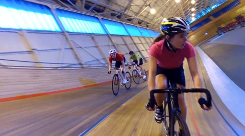 4K Action tracking shot of competitive cyclists racing on track in velodrome Stock Footage 60185286