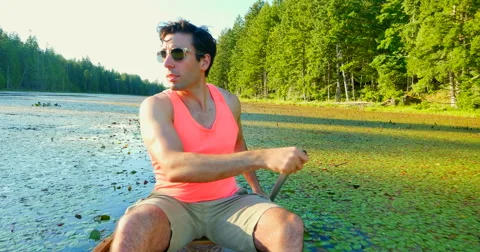 4K Active Man Enjoying Warm Summer Day in Canoe Stock Footage 41719231