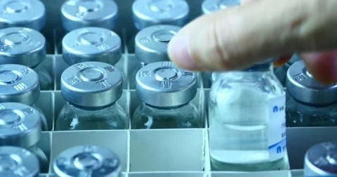 4k Add injection bottle from box.medical health hospital equipment & drug vial. Stock Footage