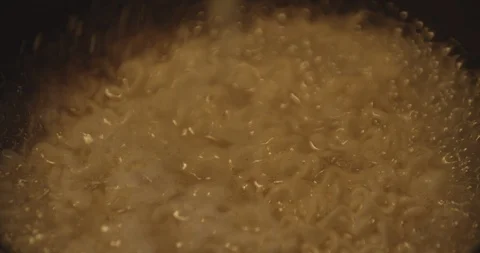 4K Adding Flavor Packet To Ramen Stockbeeldmateriaal 108445258