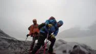 4K Adventure Hikers Battle Strong Winds In Storm Stock Footage