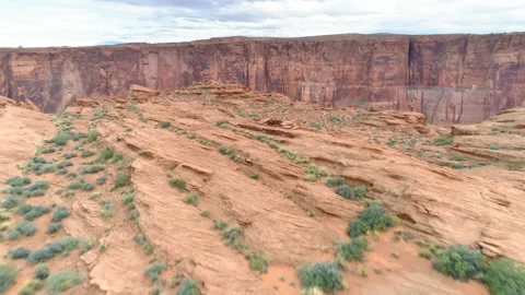 4K aerial above dramatic red Horse Shoe Bend with Colorado river in the canyon Stock Footage 134572478