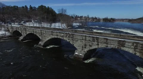 4k aerial ascending view of old stone bridge Stock Footage 62938565