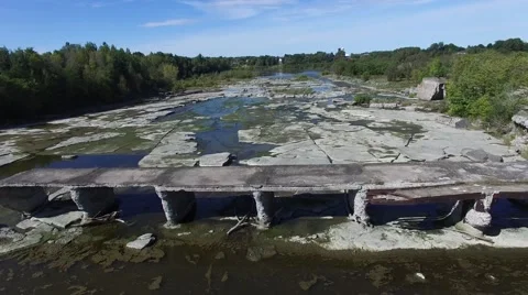 4k aerial broken train bridge, flying birds and river bed Stock Footage 55355930