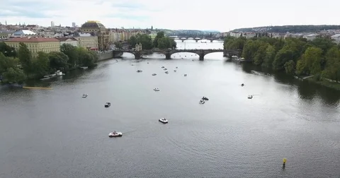 4K. Aerial camera slowly moves away from Prague castle, the Charles Bridge and Stock Footage 79144885