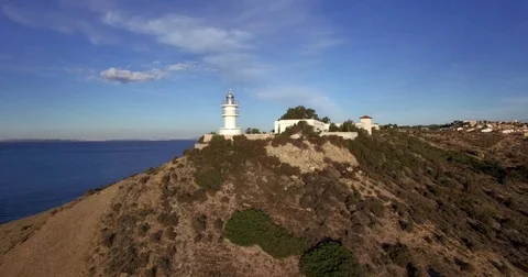 4K Aerial cape view with lighthouse from drone at sunrise Stock Footage 76385117