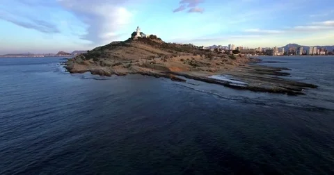 4K Aerial cape view with lighthouse from drone at sunrise Stock Footage 76385255