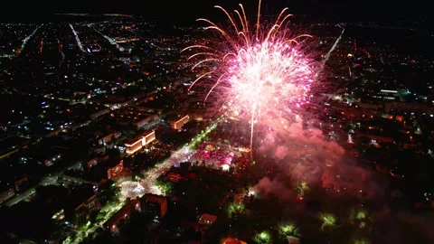 4K Aerial Close-Up of Spectacular Fireworks Exploding Above Illuminated Night Video stock 340274591