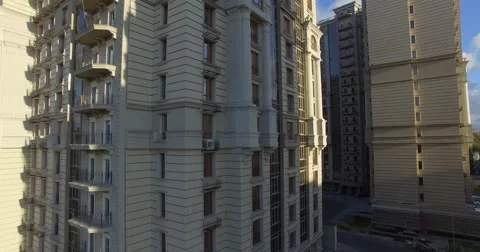 4K aerial construction of multi-storey house residential complex wall hotel Stock Footage 68099993