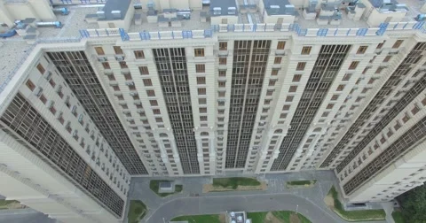 4K aerial construction of multi-storey house residential complex wall hotel Stock Footage 68100055