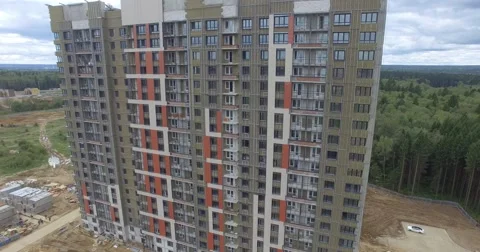 4K aerial construction of multi-storey house residential complex wall hotel Stock Footage 68376612