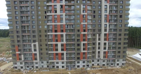 4K aerial construction of multi-storey house residential complex wall hotel Video stock 68376668