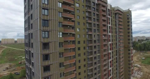 4K aerial construction of multi-storey house residential complex wall hotel Video stock 68378148