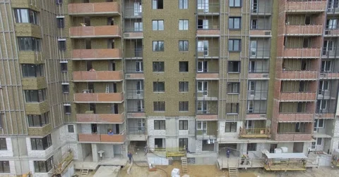 4K aerial construction of multi-storey house residential complex wall hotel Video stock 68378311