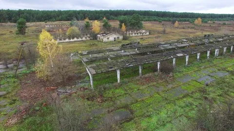   4K  Aerial.  Destroyed  cowhouse  structures  in  Chernobyl area.  Видео 83589433