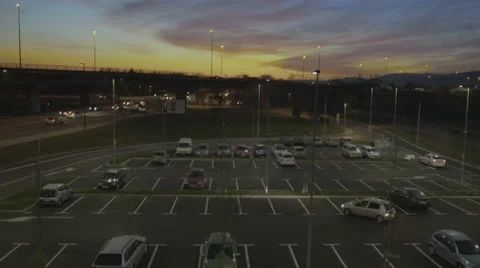 4K Aerial: Dolly Rear Shot Over Parking Area at Dusk Vidéo 59790832