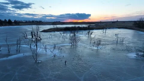 4K Aerial Drone Abstract Background Landscape Trees In Frozen Lake Sunset Stock Footage 234068653