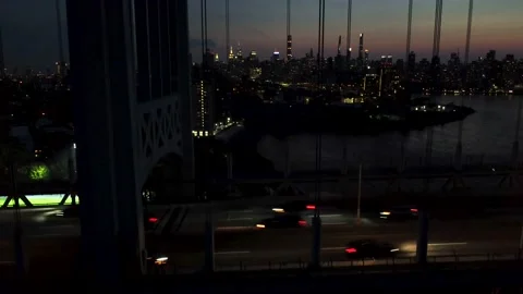 4K Aerial Drone Descending Below Bridge + New York Skyline at Night Stock Footage 165359457