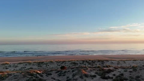 4K Aerial: Drone flight along coast towards Punta Umbria resort town Spain. Stock Footage 333637586