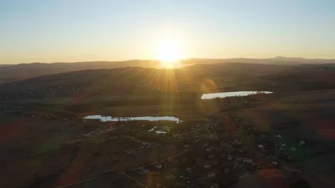 4K Aerial Drone, Flight to the Sunset over Village and Lakes Video stock 124018526