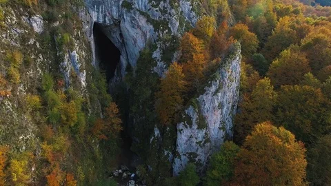 4k aerial drone flying backwards from the entrance of Huda of Papara Cave. Stock Footage 78630813