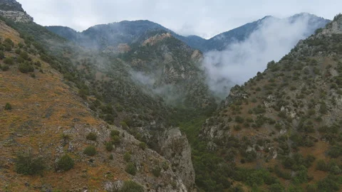 4K Aerial Drone Flying Into A Cloudy Valley Alternate 1 Video stock 159258646