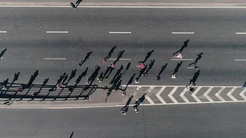 4K Aerial drone fooage. Marathon running on street. Group of support. Top view 스톡 동영상 89825360