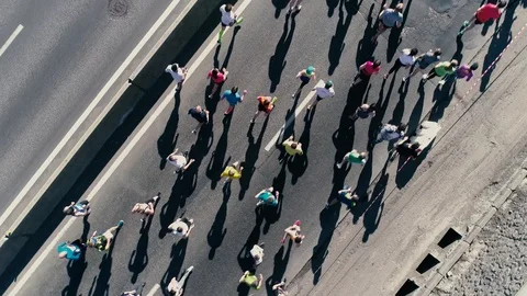 4K Aerial drone fooage. Marathon running on street. Camera rotate. Top view Stock Footage 89825899