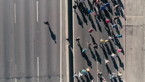 4K Aerial drone fooage. Marathon running on street. Following camera. Top view Видео 89826628