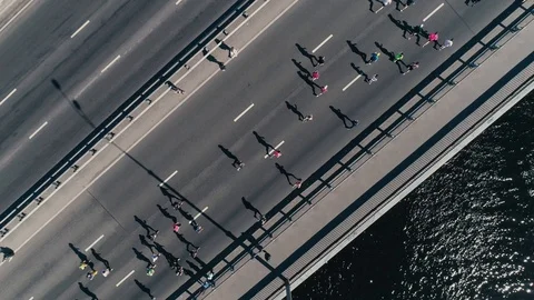 4K Aerial drone fooage. Marathon running on the bridge. Camera top view Stock Footage 89827256