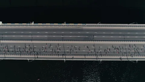 4K Aerial drone fooage. Slow motion Marathon running on the bridge. Horizontal 스톡 동영상 89825238