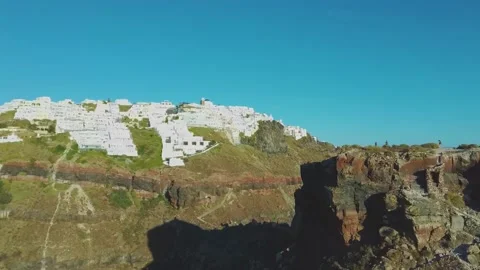 4k Aerial drone footage flying next to Skaros rock Santorini Greece Stock Footage 144938646