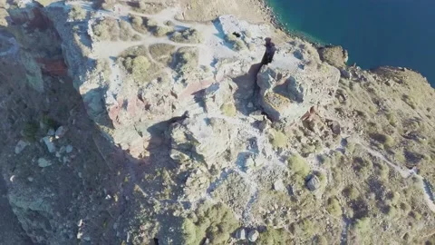 4k Aerial drone footage flying over Skaros rock Santorini Greece with Stock Footage 144938663