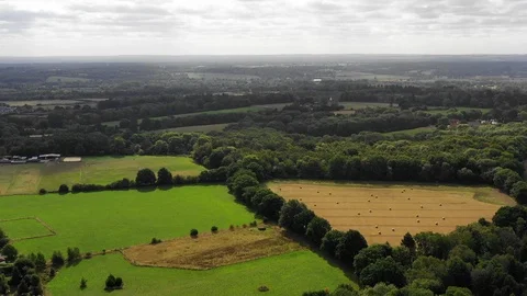 4K aerial drone footage flyover deciduous forest english countryside road Stock Footage 95208160