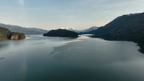 4k Aerial Drone Forward &amp; Dropping Over Lake With Forested Mountains On Horizon Stock Footage 275067221